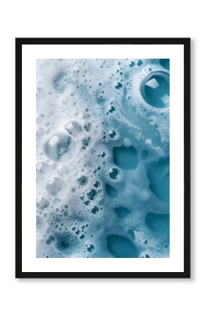 Macro photo of bubbles in water. Blue background with white foam made of soap, shampoo, lotion, detergent. Banner with copy space for laundry and cleaning services, beauty, skin care, spa, concept.