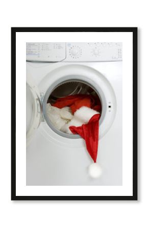 Christmas wash: washing machine with a red Santa suit