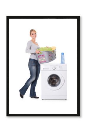Woman With Detergent And Laundry Standing By Washing Machine
