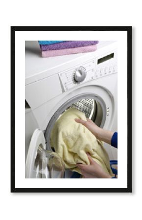 Pouring detergent into the washing machine