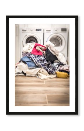 Pile of dirty clothes in laundry room