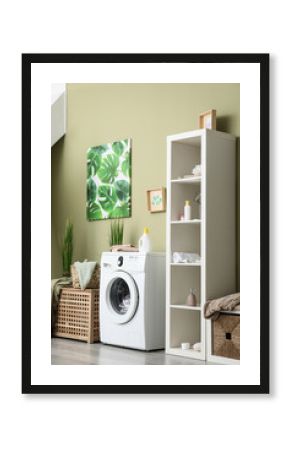 Interior of home laundry room with modern washing machine