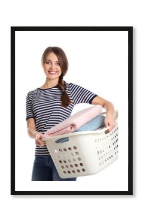 Happy young woman holding basket with laundry on white background