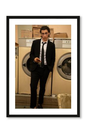 business man in laundromat 