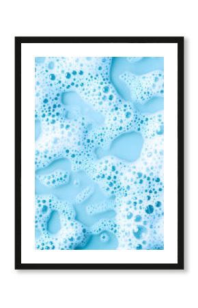 White foam cream texture, soap bubble or cosmetic gel clean foam isolated on blue background with copy space