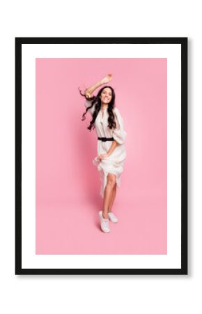 Vertical photo portrait of girl wearing fashion outfit dancing at floor party smiling isolated on pastel pink color background