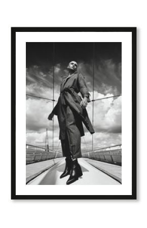 low angle view of male fashion model posing in city