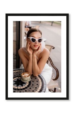 Summer fashion look. Woman in a white suit and retro sunglasse. Close-up portrait