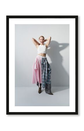 Cheerful fashion model posing in sunlight