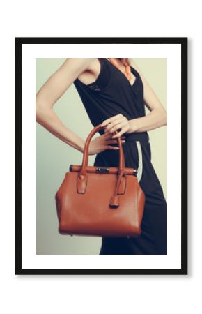 Elegant fashion woman with leather handbag