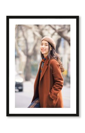 Beautiful young brunette woman with blur street background. Outdoor fashion portrait of glamour young Chinese cheerful stylish lady. Emotions, people, beauty and lifestyle concept.