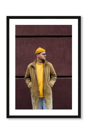 Photo of a young fashion stylish trendy look man model  in color clothes modern style outdoor street style  natural light