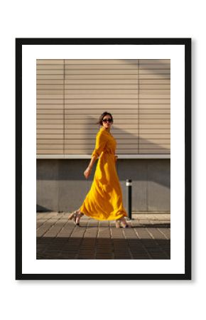 Fashionable woman in yellow dress