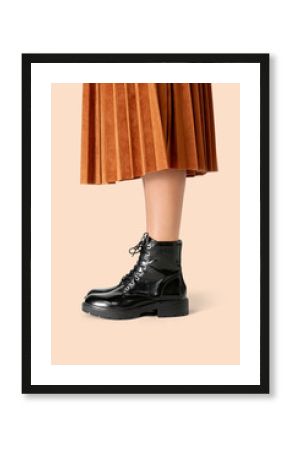 Woman in a skirt wearing combat boots