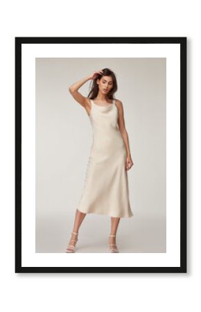 Beautiful woman fashion model makeup brunette hair perfect body shape tanned skin wear clothes summer collection organic midi white silk dress stylish sandals shoes, accessory romantic date walk.