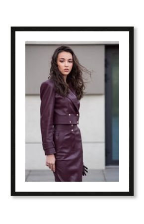 Modern feminine outfit with high-quality burgundy leather skirt and structured jacket styled for elegant urban street fashion look
