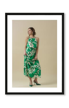 Serie of studio photos of young female model in large floral green linen long camisole dress. Casual and stylish summertime outfit, spring-summer fashion trend.
