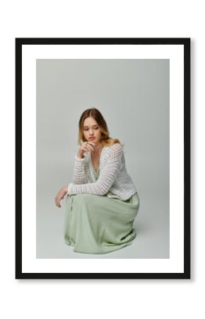 Stylish young woman showcases spring fashion in a serene studio setting with soft lighting