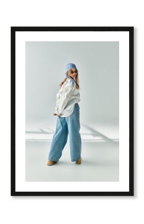 Stylish young woman showcasing spring fashion in a chic studio setting