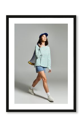 Sunshine stroll with a stylish young woman in trendy summer fashion and a playful attitude