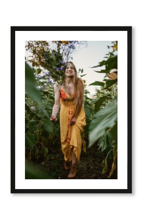 Summer outfit, Summer fashion, natural beauty. Outdoor candid portrait Young blonde woman n ristic yellow dress and straw hat on green field nature background