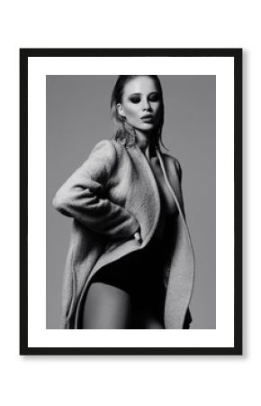 High fashion look.glamor beautiful sexy hot stylish young blond woman model in overcoat in studio