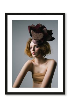 Portrait of a female fashion model with extravagant hat