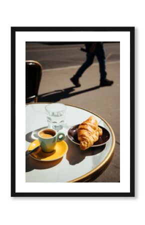 France, Paris, Croissant, coffee and glass of water on sidewalk cafe table