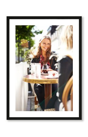 Catching up with an old friend. Two young girlfriends meeting at a cafe for coffee and a chat.