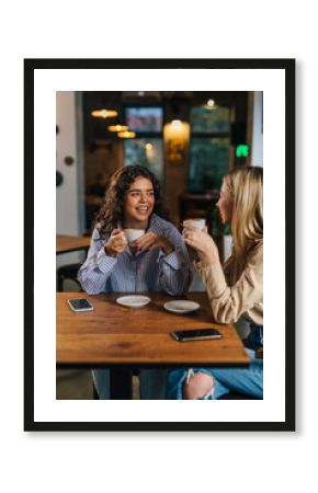 Two women hang out in a cafe