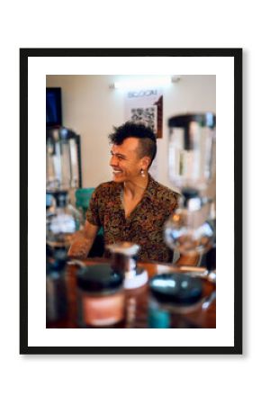 latino mid adult barista or bartender in a coffeehouse smiling happy behind a counter