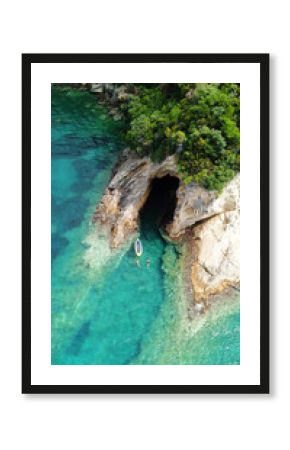 Aerial drone bird's eye view photo of famous caves in Sivota area, Epirus, Greece