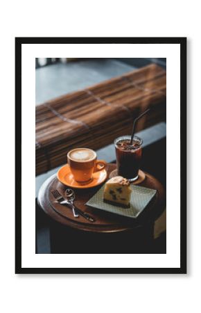 cup of coffee and cake on table