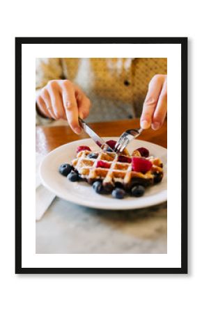 Anonymous woman having breakfast.