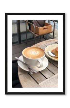 A beautifully crafted latte, featuring creamy foam art on top of rich espresso. Perfect for coffee-related projects, this image captures the warmth and inviting nature of a classic café experience.