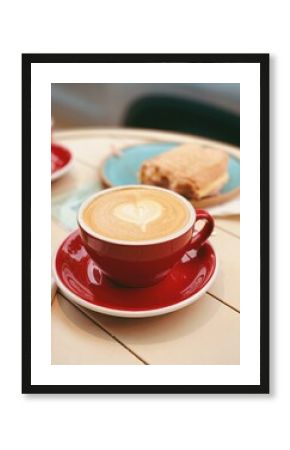 Foto de un cafe au lait con arte latte