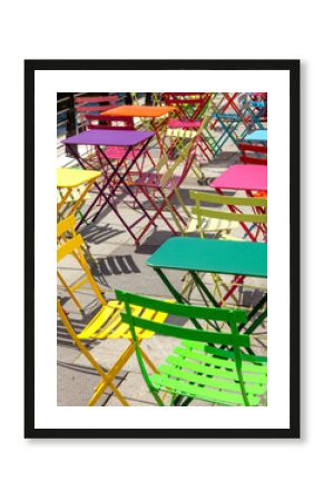 Vibrant colorful chairs and tables at outdoor area of café 