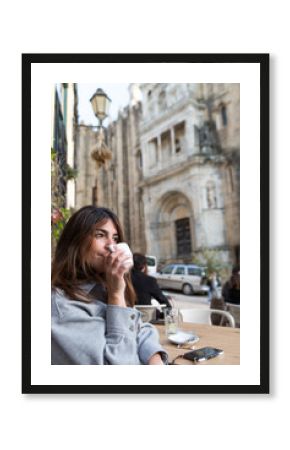 Woman in an outdoor cafe
