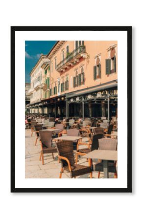 Empty street cafe in Verona old city, Italy. Beautiful sunny morning.