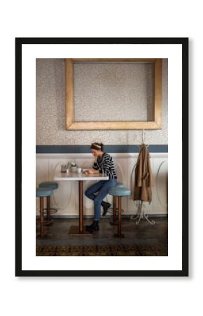 woman drinking coffee in a cafe