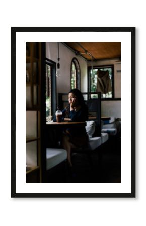 Urban young woman sitting alone in the cafe
