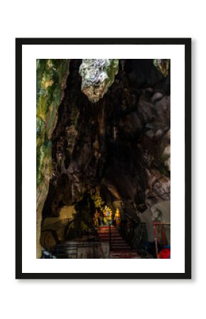 Distant deity statues deep in Batu Caves, Kuala Lumpur