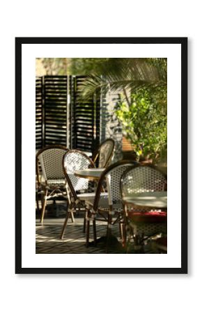 Restaurant, cafe for events, dining with chairs and tables. Atmospheric Italian, Spanish terrace with greenery. Sunny Portuguese place to relax. Restaurant at hotel. Lots of plants in establishment