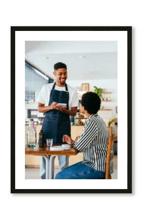 Bakery, happy portrait of black woman in cafe ready for serving pastry, coffee and baked foods. Restaurant, coffee shop and confident waiter barista by counter for service, help and welcome