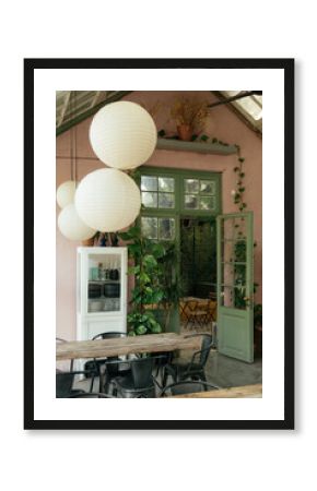 Cozy café interior with plants and soft lighting in the afternoon