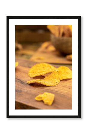 potato chips and beer on wooden background in a cafe, pub or at home