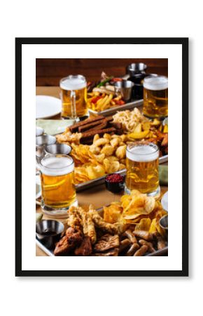 Table set with beer and salty snacks in a pub