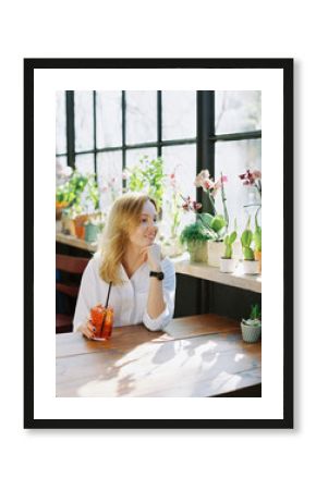 Thoughtful Blonde Woman With Cocktail 