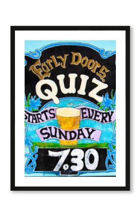 Close up on colorful British pub quiz sign