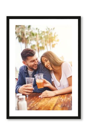 happy hispanic couple drinking beer in outdoor pub